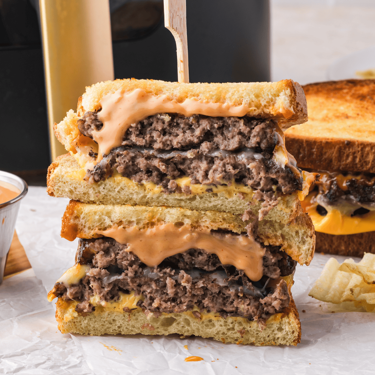 Steak and Shake Frisco Patty Melt with beef, cheese, and Thousand Island dressing on toasted sourdough.