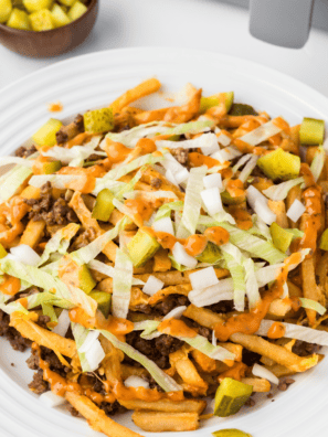 Taco Bell Baja Sauce drizzled over crispy fries, adding a creamy, zesty flavor.