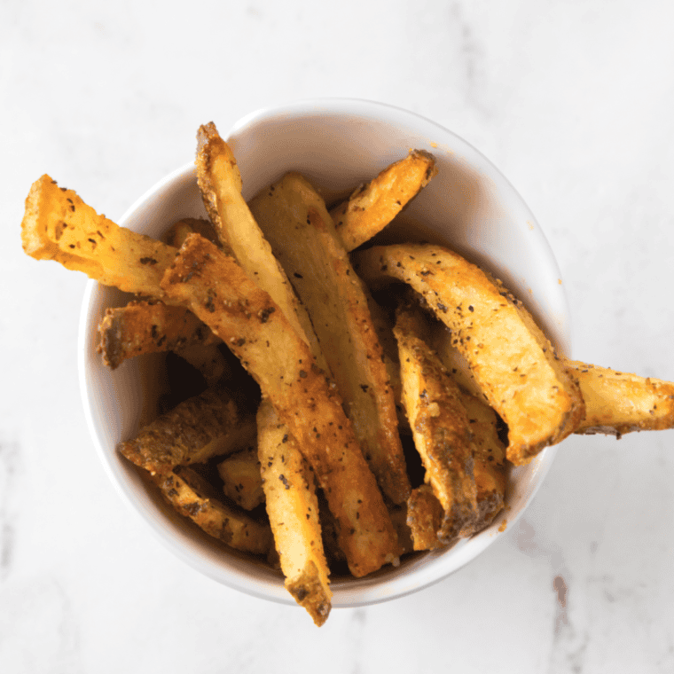 Crispy, seasoned Texas Roadhouse-style steak fries, golden and fluffy