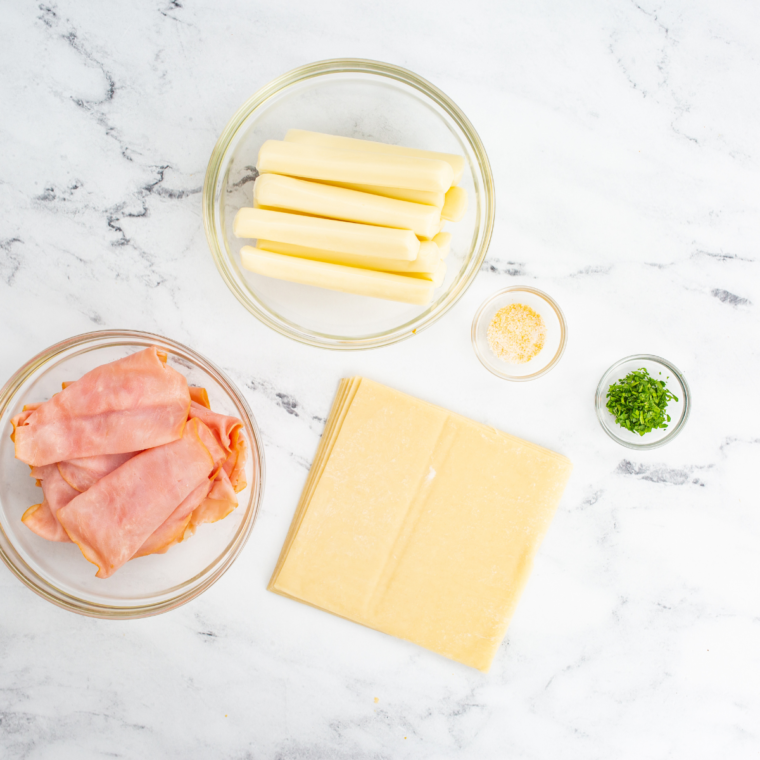 Air Fryer Ham and Mozzarella Cheese Sticks ingredients on kitchen table.