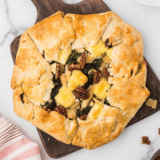 Golden-brown rustic chicken tart with puff pastry, cherry tomatoes, and herbs cooked in an air fryer