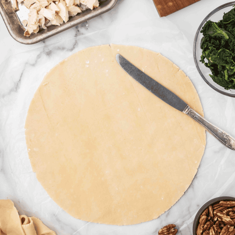 Roll out the pie dough on a flat surface.