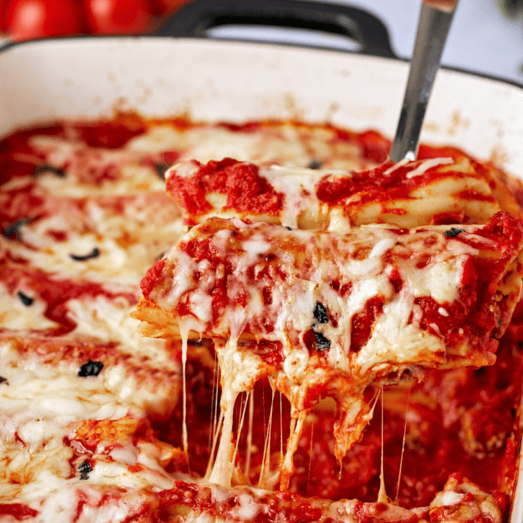Stuffing manicotti shells with a creamy ricotta and mozzarella cheese mixture.