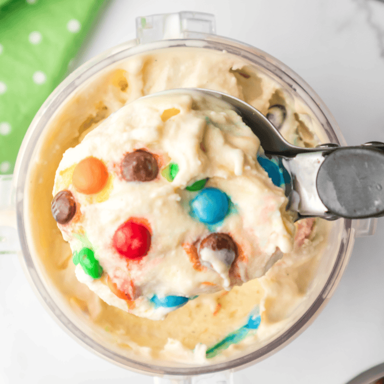 Creamy Ninja Creami M&M Blast with colorful candies mixed into soft vanilla ice cream, served in a bowl