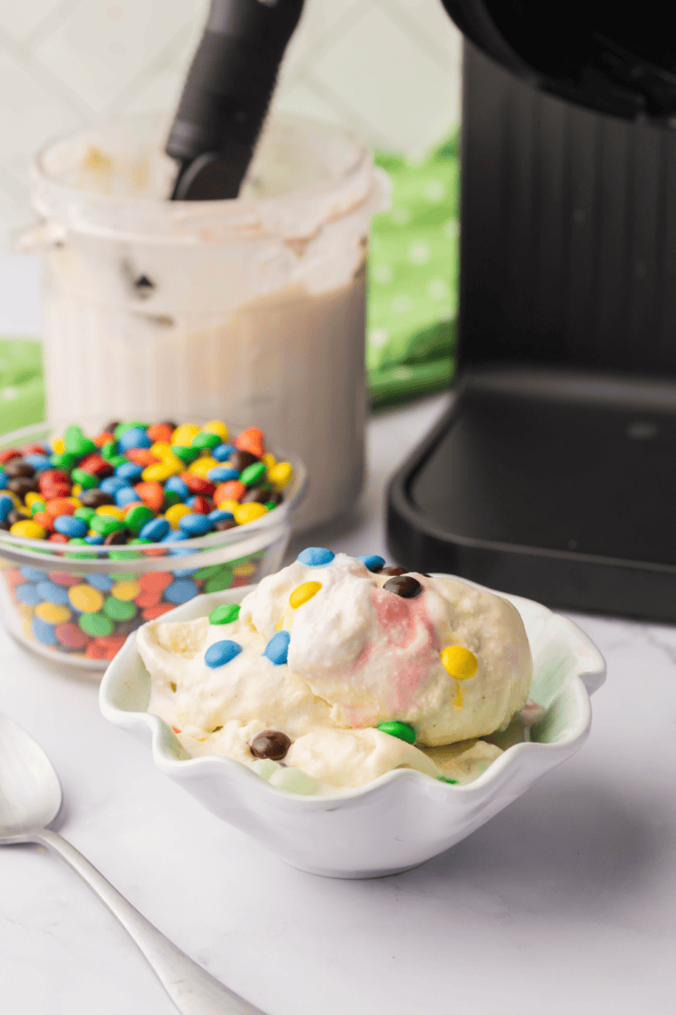 Bowl of Ninja Creami Sonic M&M Blast with creamy vanilla ice cream mixed with colorful mini M&M candies