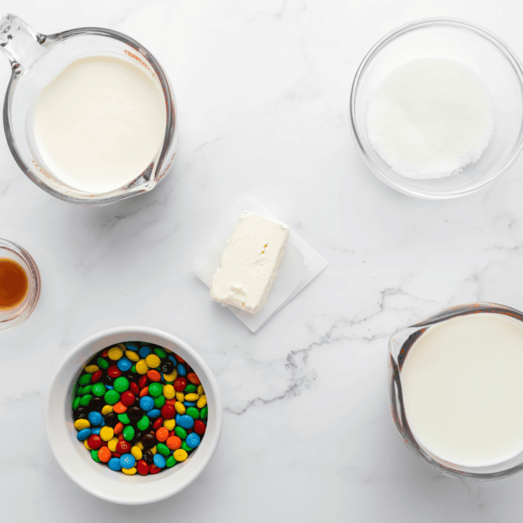 Ingredients needed for Ninja Creami Sonic M&M Blast on kitchen table.
