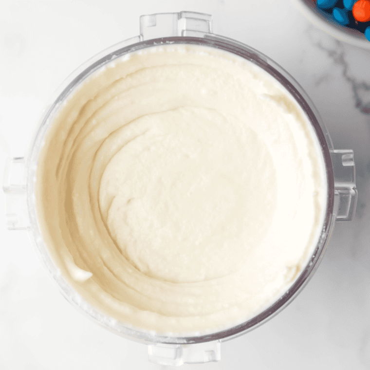 Ninja Creami processing frozen ice cream base after pressing the "Ice Cream" button to create a smooth, creamy texture
