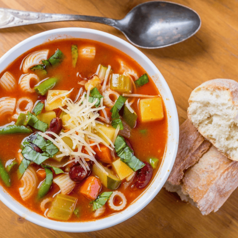 Bowl of Minestrone Soup on kitchen table.