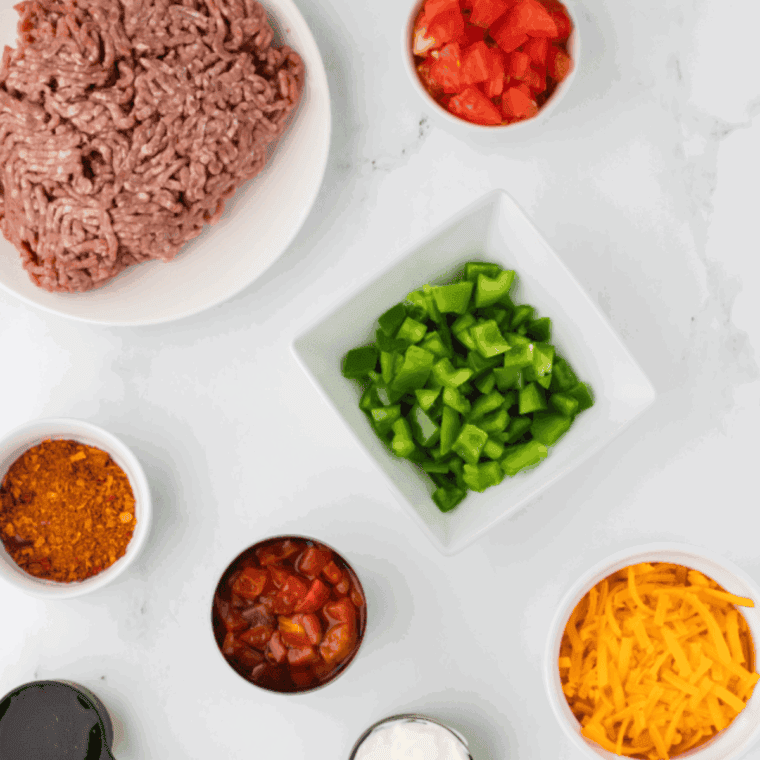 Ingredients needed for Air Fryer Cheeseburger Casserole on kitchen table.