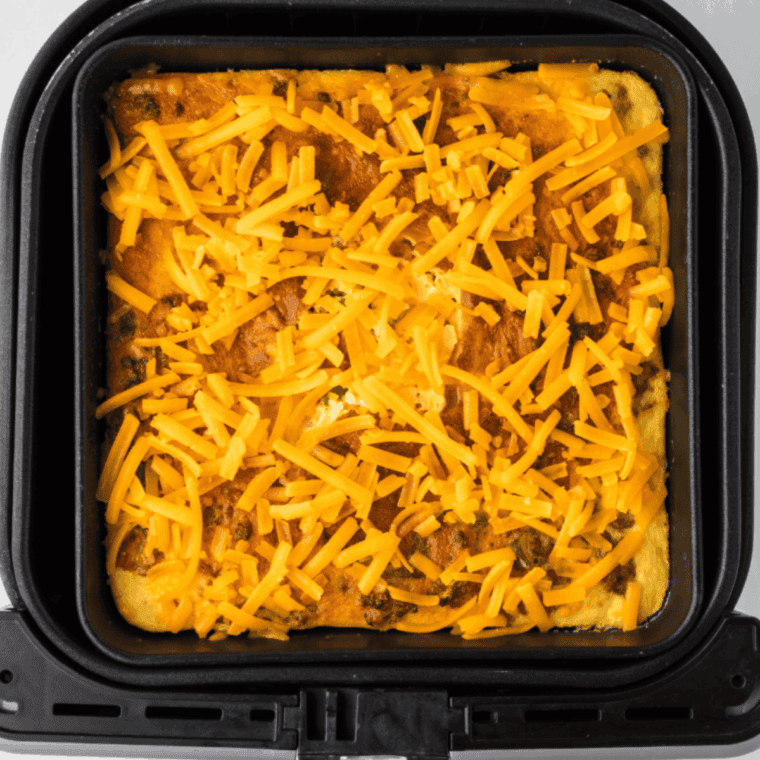 Add the cheese on top of the cheeseburger casserole.