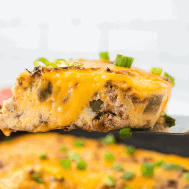 Air fryer cheeseburger casserole with ground beef, pasta, and melted cheese served hot in a baking dish.