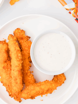 Golden and crispy Air Fryer Cheetos Chicken Fries served with a dipping sauce.