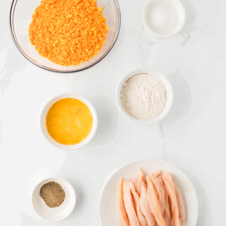 Ingredients needed for Air Fryer Cheetos Chicken Fries on kitchen table.