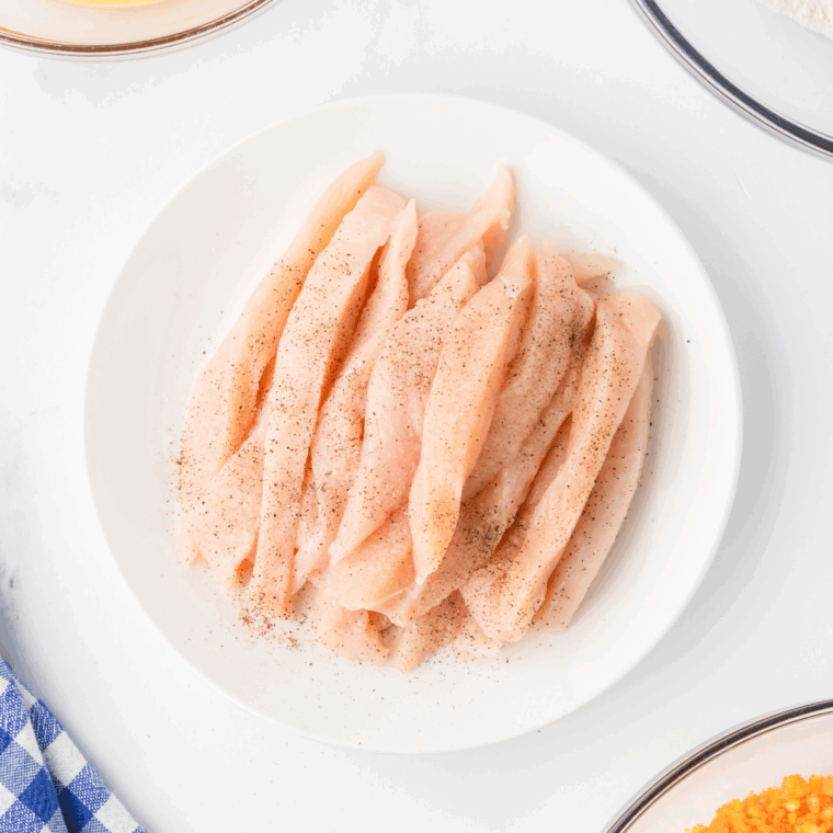 Season chicken tenders with salt and black pepper, on both sides.