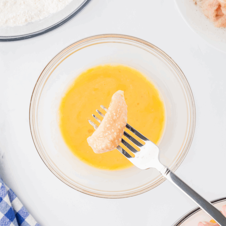 Dip the chicken into the flour mixture, and then in the beaten eggs. 