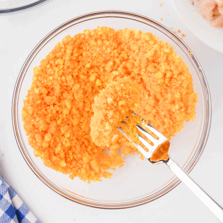Coat the chicken with crushed Cheetos.