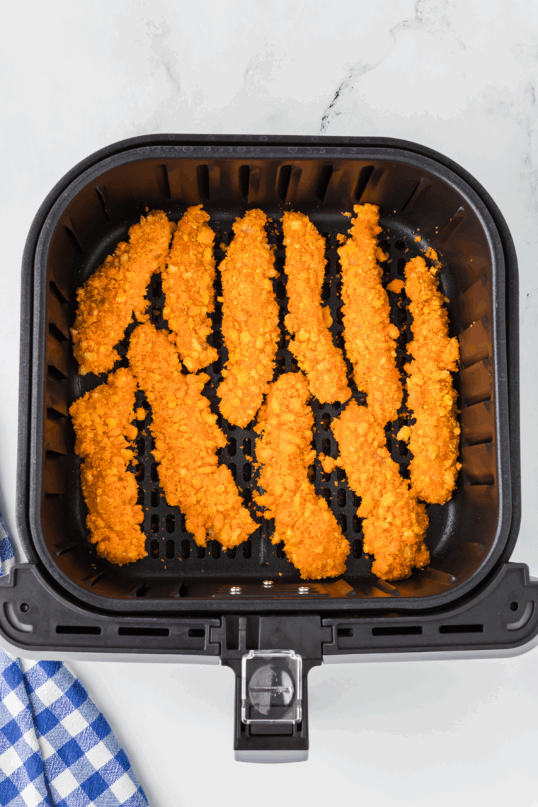 Place Cheetos Chicken Fries in the air fryer basket.