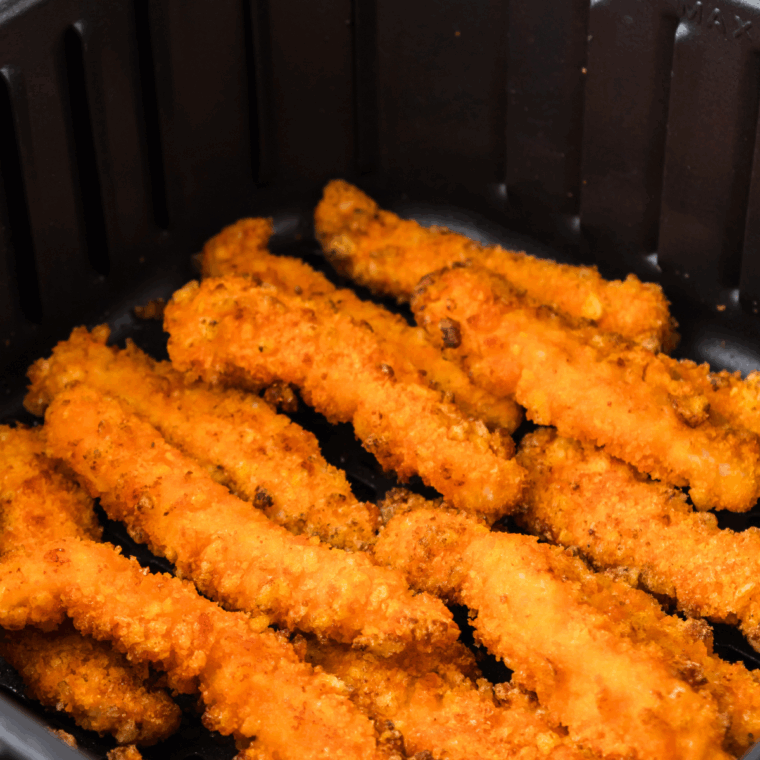 Air fryer Cheetos chicken fries coated in crushed Cheetos for a crispy, flavorful snack.