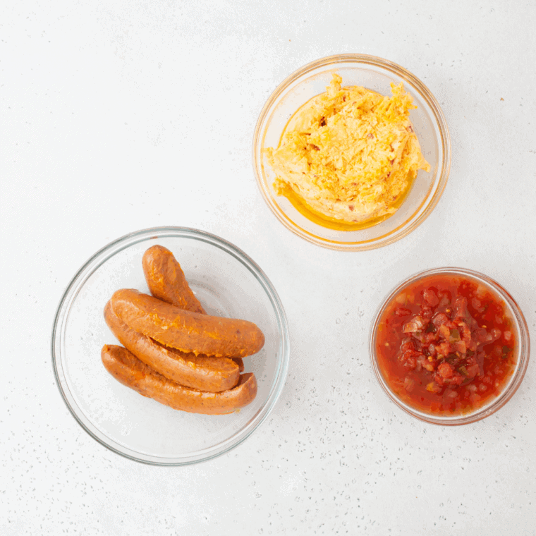 Ingredients needed for Air Fryer Chorizo Pimento Cheese Dip on kitchen table.