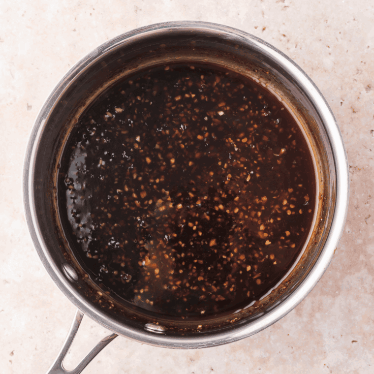 Simmering soy sauce, hoisin and seasonings until creates a sauce.