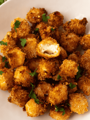 Air Fryer Crispy Halloumi Bites with a golden, crispy exterior and soft interior.