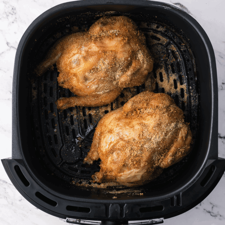 Returning Cornish hens to the air fryer, breast side up, cooking at 360°F for 20-30 minutes until the internal temperature reaches 165°F