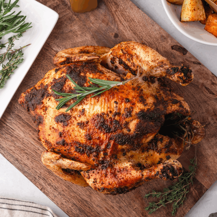 Whole chicken cooked from frozen in the air fryer, golden brown with crispy skin and juicy interior.