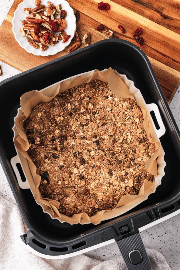 Golden, crispy Air Fryer Granola Clusters with oats, nuts, and dried fruit.