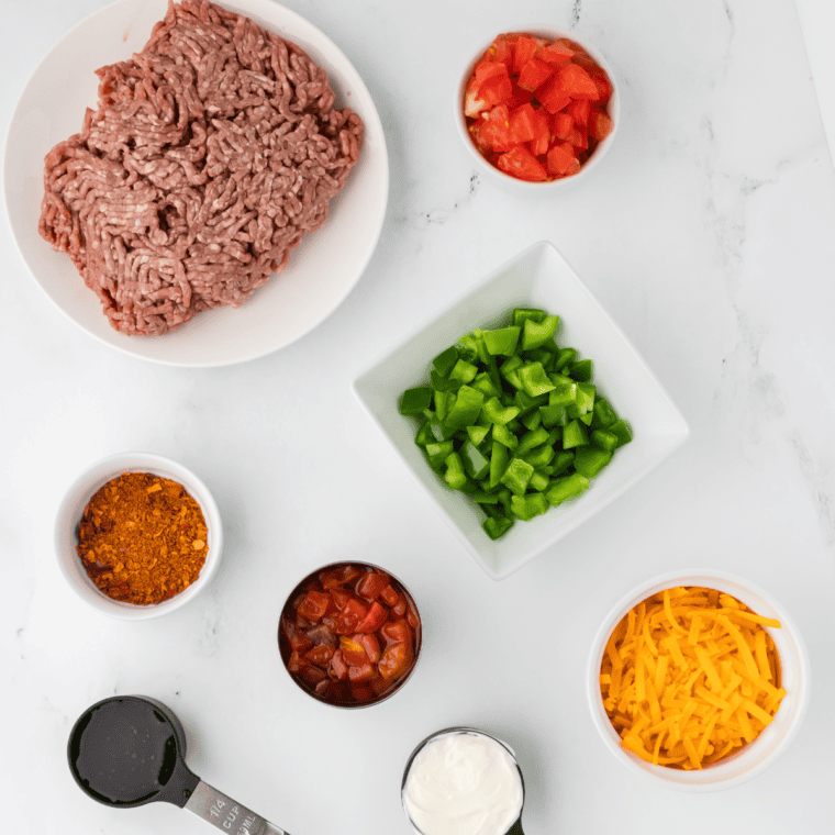 Ingredients needed for Air Fryer Ground Beef Casserole on kitchen table.