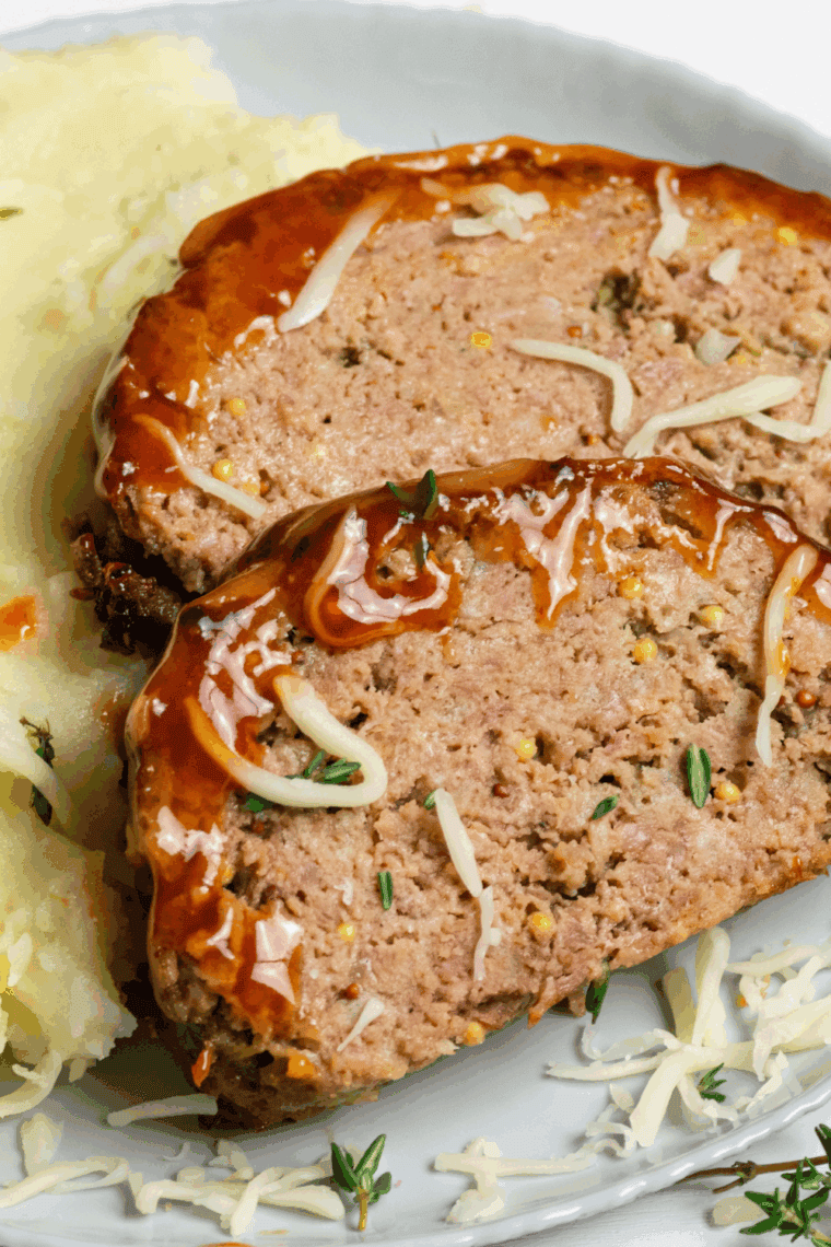 Air Fryer Guinness Cheddar Meatloaf with melted cheddar and a Guinness-infused flavor.