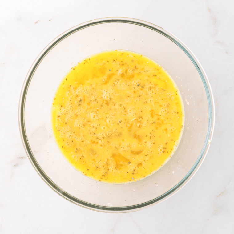 Whisk the eggs until frothy.