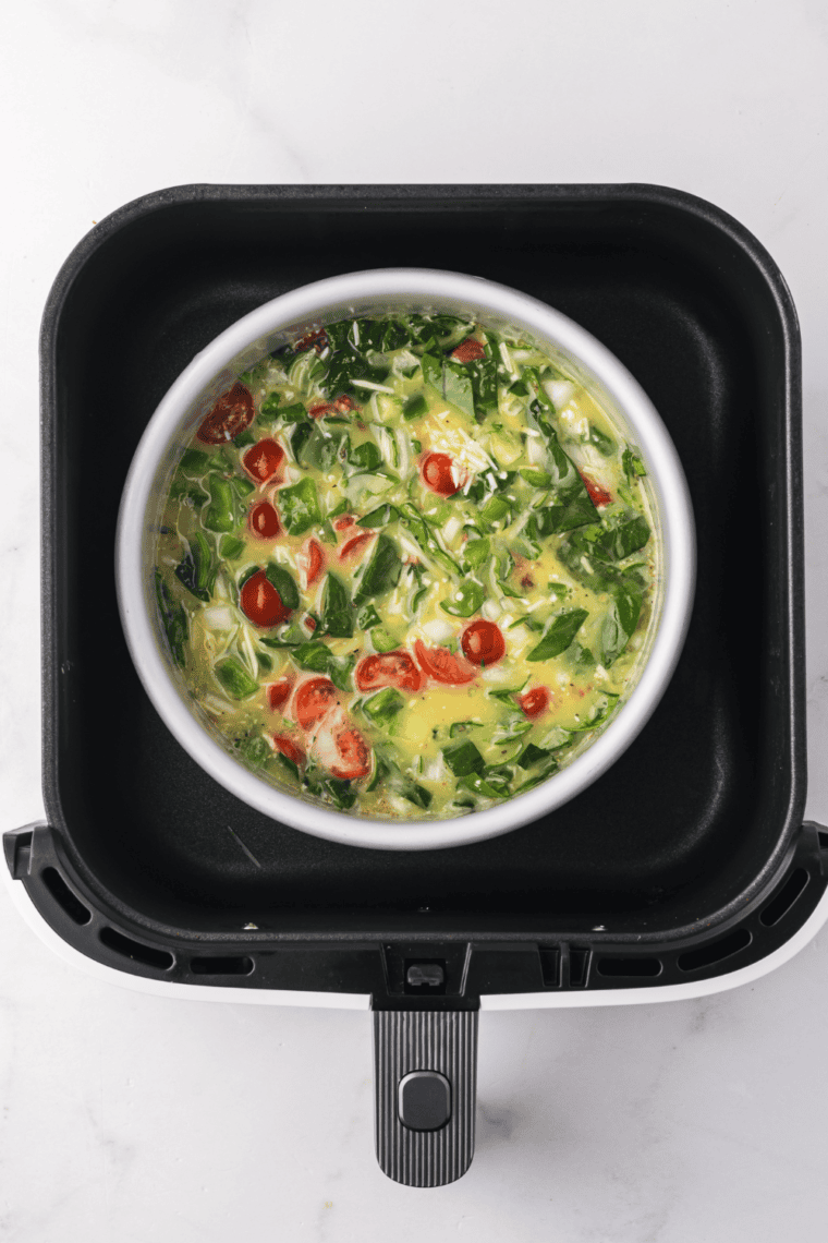Place the frittata pan in the air fryer basket.