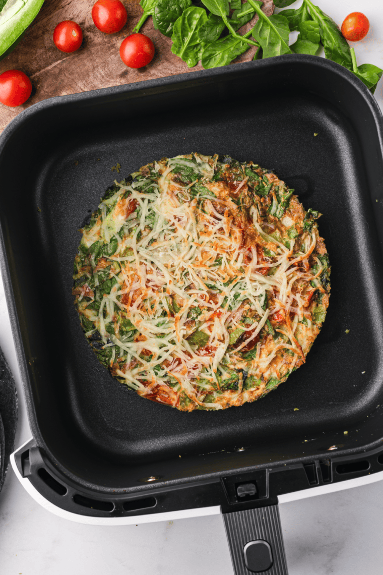 Air Fryer Italian Frittata with eggs, vegetables, and cheese, cooked to perfection for a fluffy and savory meal.