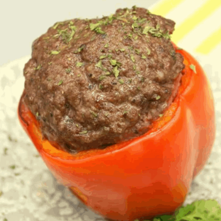 Air fryer meatloaf stuffed peppers filled with ground meat and rice mixture.
