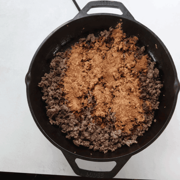 Mixing all of the ingredients in the cast iron pan, getting ready to assemble the Mexican lasagna.
