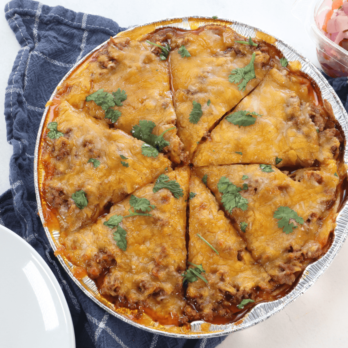 Air Fryer Mexican Lasagna with layers of seasoned beef, cheese, and tortillas.
