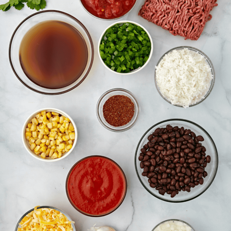 Ingredients needed for Air Fryer Mexican Rice Casserole on kitchen table.