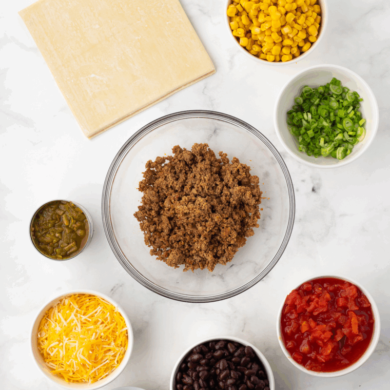 Ingredients needed for Air Fryer Taco Egg Rolls on kitchen table.
