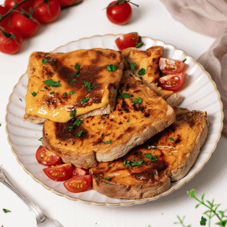 Air Fryer Welsh Rarebit with creamy cheese sauce served on crispy toast.