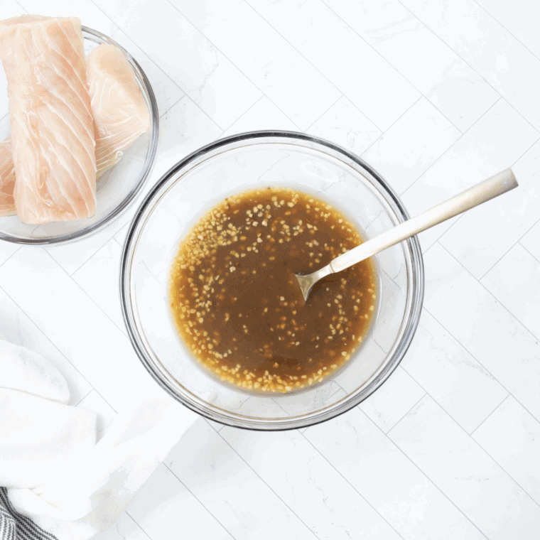 Marinating mahi mahi fillets in teriyaki sauce, sherry, and garlic.