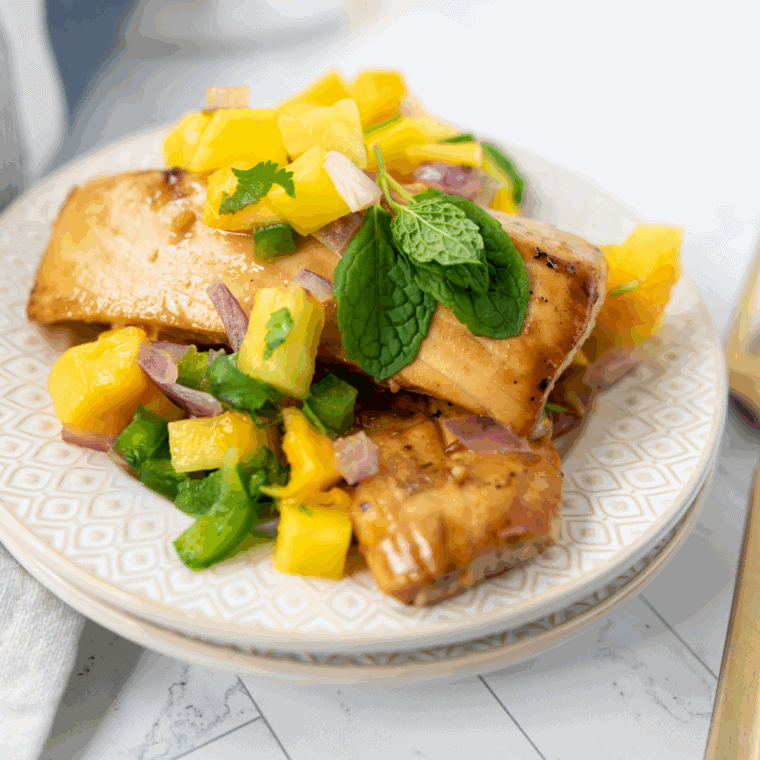 Blackstone Mahi Mahi with perfectly cooked, tender fish on the griddle.