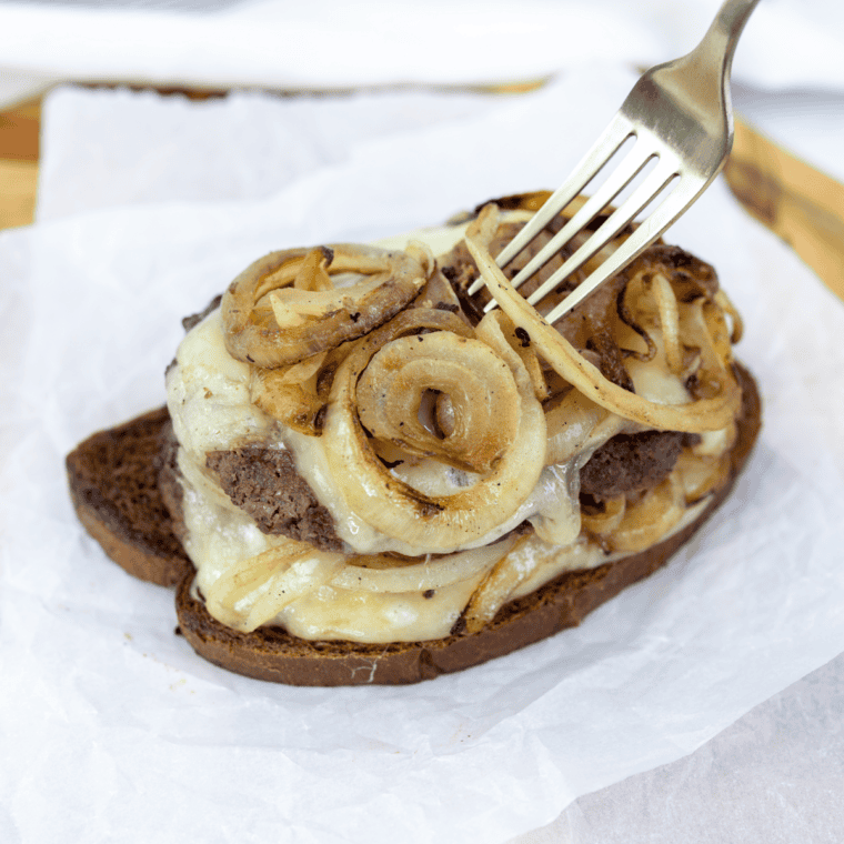 Blackstone Patty Melt with juicy beef, melted cheese, and crispy toasted bread.