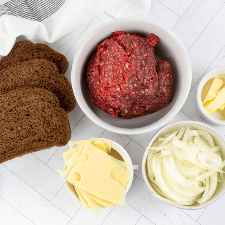 Ingredients needed for Blackstone Patty Melt on kitchen table.