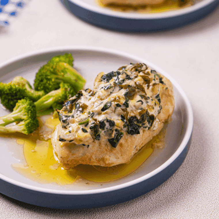 Golden, juicy Bonefish Grill Copycat Lily's Chicken topped with a creamy lemon basil sauce and garnished with fresh herbs.