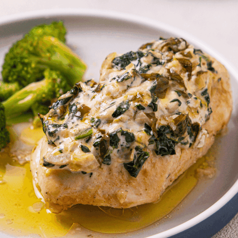 Golden, juicy Bonefish Grill Copycat Lily's Chicken served with creamy lemon butter sauce and garnished with fresh herbs.