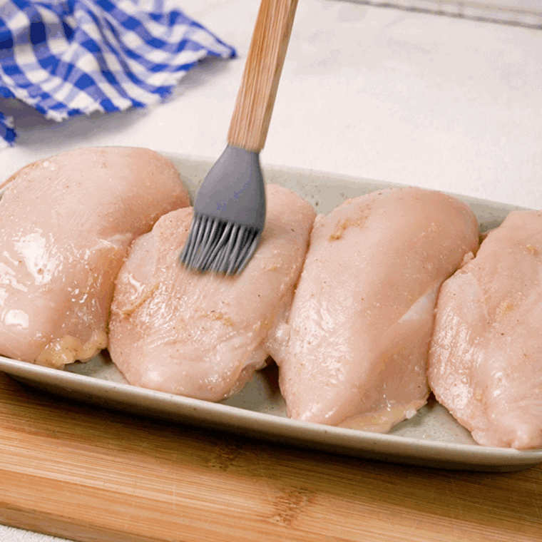 Brush olive oil, over the top of the chicken.