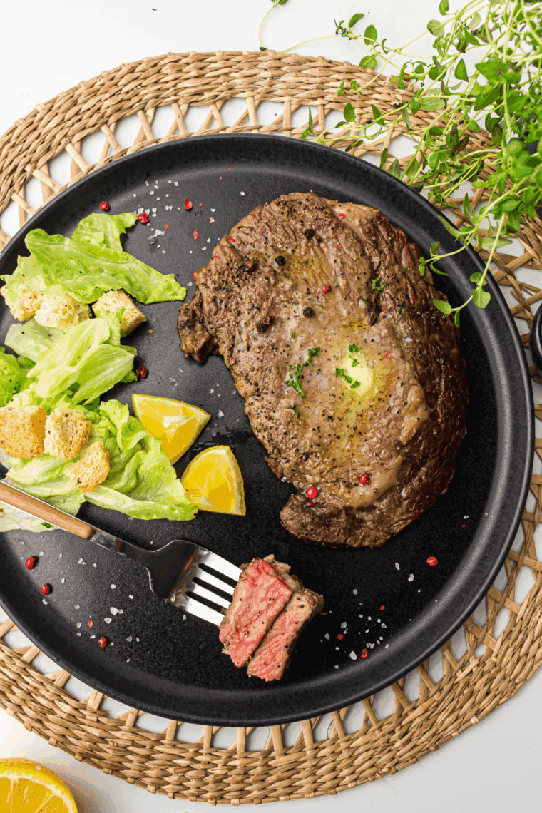 Copycat Applebee’s Bourbon Street Steak with sautéed onions and a rich bourbon glaze, perfect for a savory and hearty dinner.
