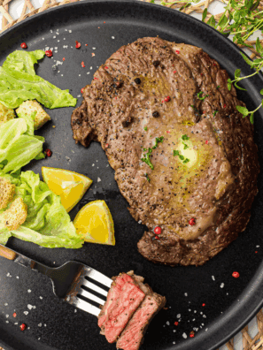 "Copycat Applebee's Bourbon Street Steak served with sizzling onions and a rich bourbon glaze, perfect for a hearty dinner."