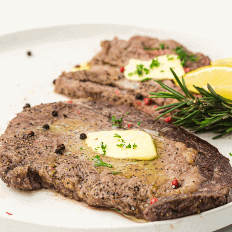 Copycat Applebee’s Bourbon Street Steak with sautéed onions and a bourbon glaze, served for a flavorful and hearty dinner.