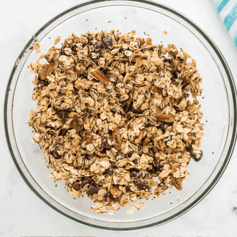 Whisking together vegetable oil, honey, brown sugar, and vanilla extract, then mixing with dry ingredients.